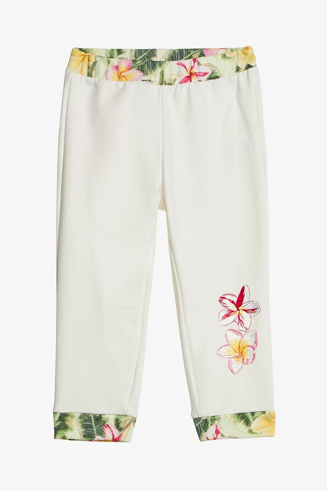 Pants With Embroidered Flowers And RC Monogram