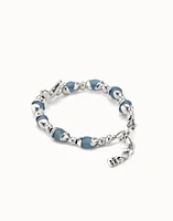 Beaded bracelet with blue crystals and a central butterfly