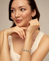 Beaded bracelet with blue crystals and a central butterfly