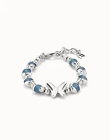 Beaded bracelet with blue crystals and a central butterfly